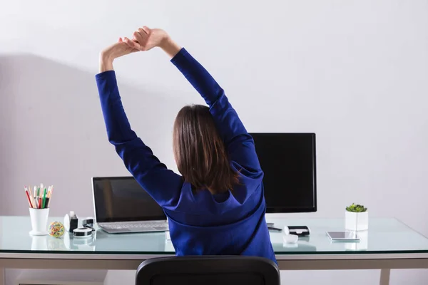 Close Young Businesswoman Stretching Her Arms Workplace — Stock Photo, Image