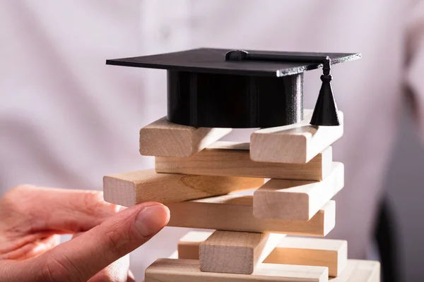 Graduation Hat Businessperson Hand Arranging Wooden Blocks — Stock Photo, Image