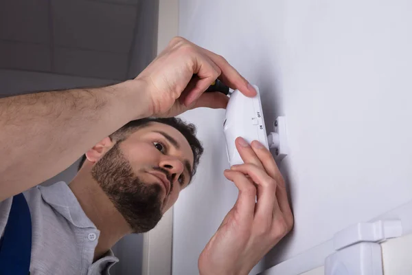 Close Young Male Electrician Installing Security System Door Sensor Wall — Stock Photo, Image