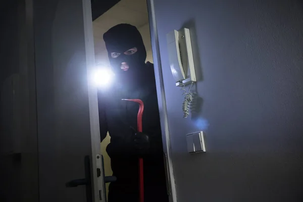 Thief Flashlight Crowbar Entering House — Stock Photo, Image