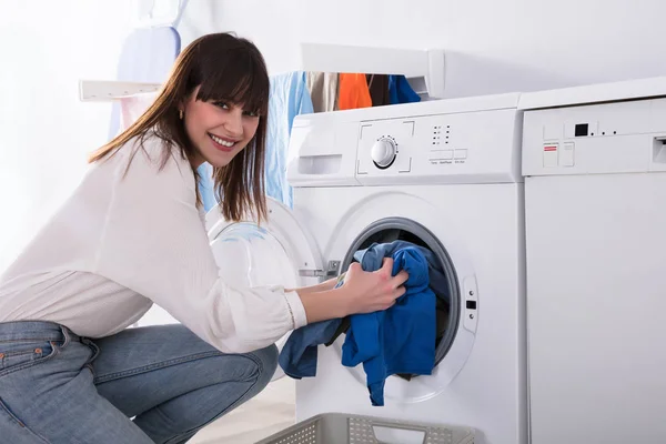 Young Woman Putting Dirty Cloth Washing Machine Laundry Room — Stock Photo, Image