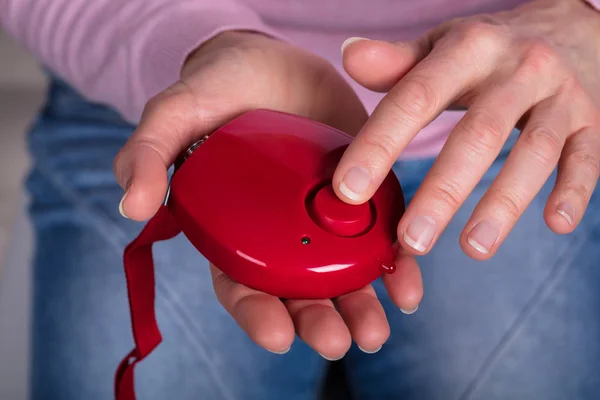 Close Woman Hand Pressing Personal Alarm Button — Stock Photo, Image