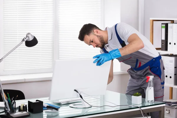 Young Male Janitor Cleaning Computer Sponge Office — Stock Photo, Image