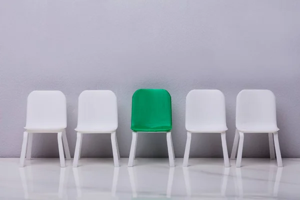 Miniature Chair Row Green One Middle Grey Background — Stock Photo, Image