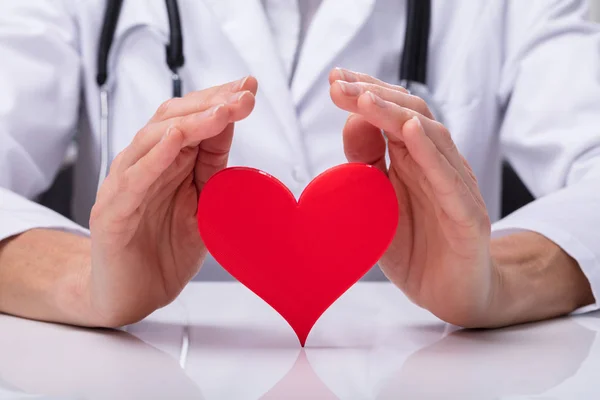 Close Doctor Hand Protecting Red Heart Shape — Stock Photo, Image