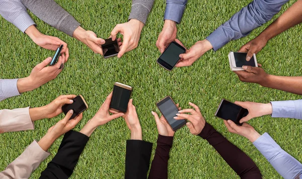 Overhead View People Hand Social Networking Mobile Cellphones Green Turf — Stock Photo, Image