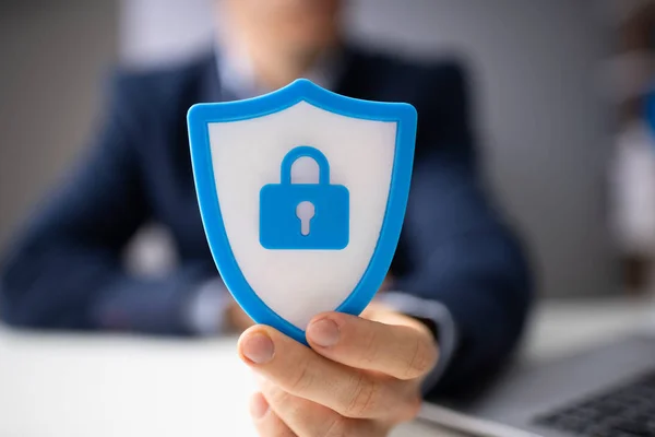 Close Businessperson Hand Holding Blue Shield Security Icon — Stok Foto