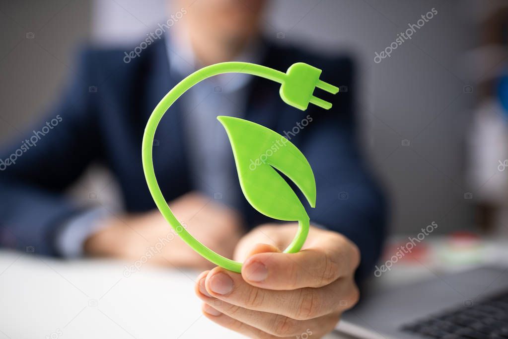 Man Holding Renewable Green Energy Concept In Hand