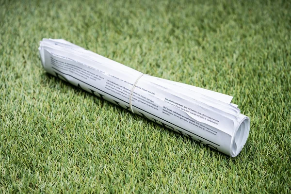 Bunch Newspapers Tied Rubber Band Green Grass Lawn — Φωτογραφία Αρχείου