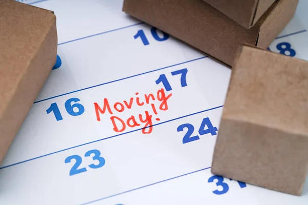 Elevated View Moving Day Text Calendar Small Cardboard Boxes — Stock Photo, Image