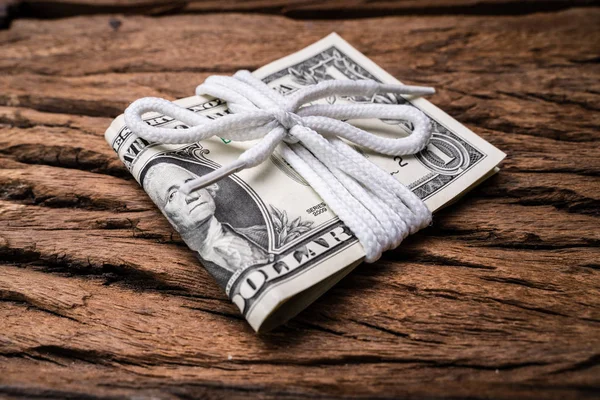 Close Dollar Bills Folded Tied White Lace Rough Wooden Textured — Stock Photo, Image