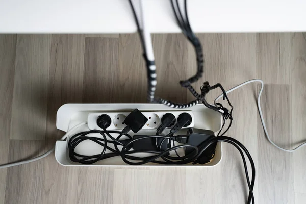 High Angle View Cable Management Box Cables Hardwood Floor — Stockfoto