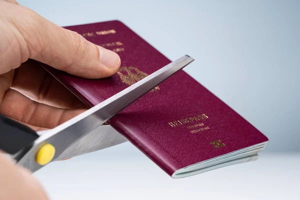 Close Person Hand Cutting Red Passport Scissor — Stockfoto