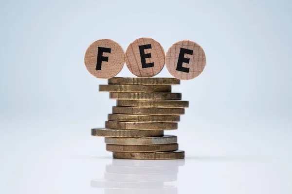 Wooden Blocks Fee Text Stack Coins Reflective Desk — Stock Photo, Image