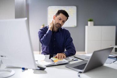 Photo Of Businessman Suffering From Neck Pain clipart