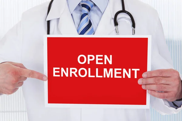 Midsection Male Doctor Pointing Open Enrollment Text Placard Holding Hand — Stock Photo, Image