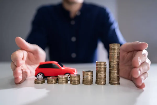 Man Hand Protecting Red Car Growing Stacked Coins Reflective Desk — Stock Photo, Image