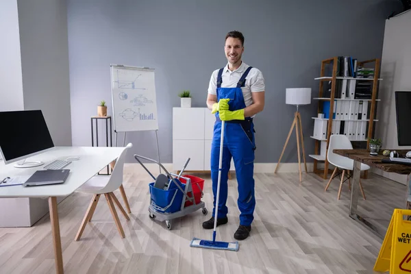 Full Length Portrait Happy Male Worker Broom Cleaning Office — Stock fotografie