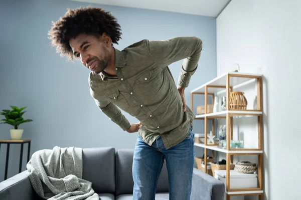 Man Having Backache While Standing Home — Stock Photo, Image