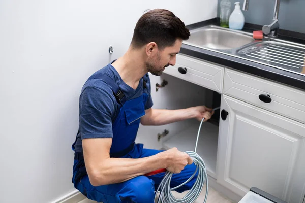 Male Plumber Cleaning Clogged Sink Pipe Kitchen — Stock Photo, Image