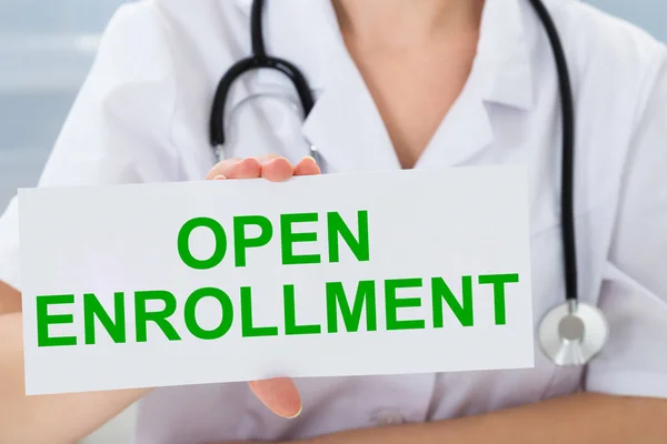 Midsection Female Doctor Pointing Open Enrollment Text Placard Holding Hand — Stock Photo, Image