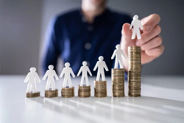 Human Hand Placing Small Human Figure Increasing Stacked Coins Wooden — Stock Photo, Image