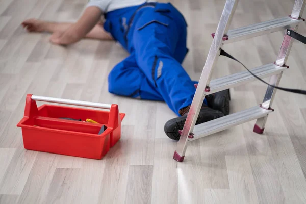 Unconscious Handyman Fallen Ladder Equipment Lying Floor — Stock Photo, Image