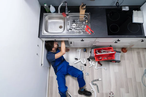 High Angle View Male Plumber Overall Fixing Sink Pipe — Stock Photo, Image