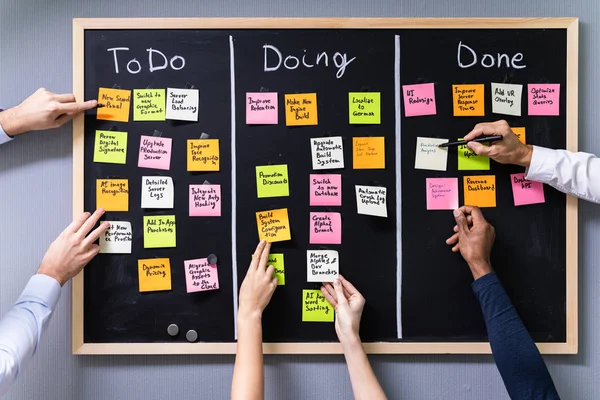 Group People Writing Sticky Notes Attached Blackboard Office — 스톡 사진