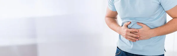 Close Young Man Suffering Stomach Ache Standing Home — Stock Photo, Image