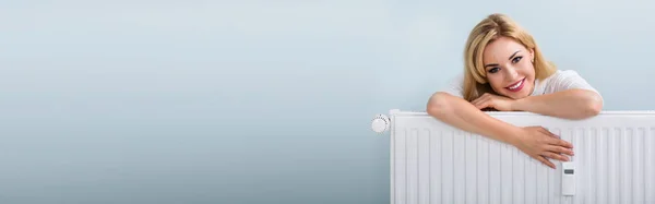 Portrait Happy Young Woman Leaning Heating Radiator — Stock Photo, Image