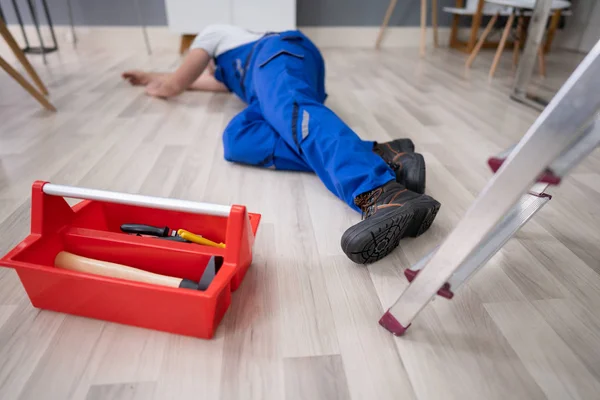 Unconscious Handyman Fallen Ladder Equipment Lying Floor — Stock Photo, Image