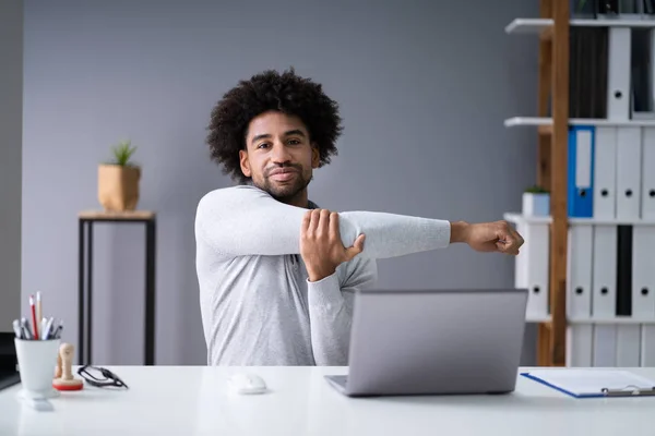 Young Businessman Stretching His Arms Laptop Desk — Stock Photo, Image