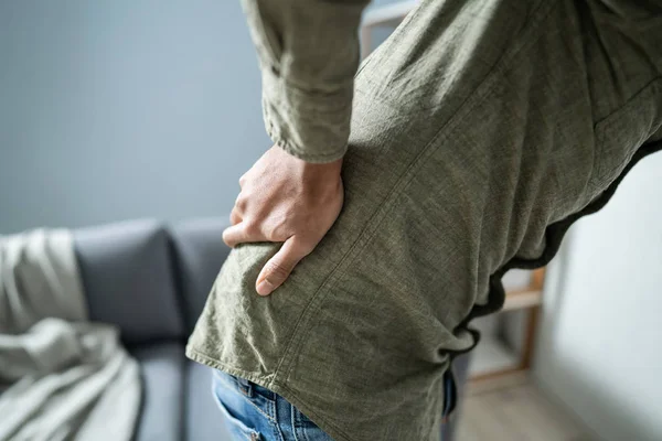 Man Having Backache While Sitting Home — Stock Photo, Image