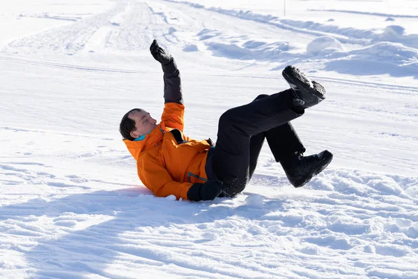 Young Man Wearing Warm Clothing Slips Falls Fresh Snowy Landscape — Stock Photo, Image