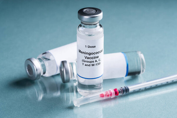 One Dose Of Meningococcal Vaccine In Vials With Syringe Over Turquoise Background