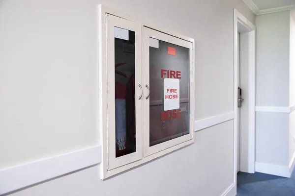 Fire Hose Reel Fire Extinguisher Hotel Corridor — Stock Photo, Image