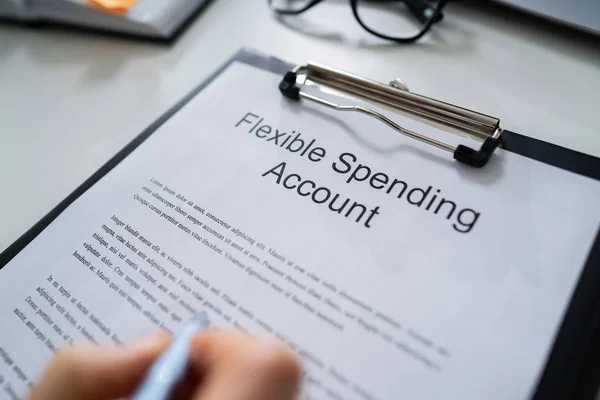 Person Reading Flexing Spending Account Fineprint Desk — Stock Photo, Image