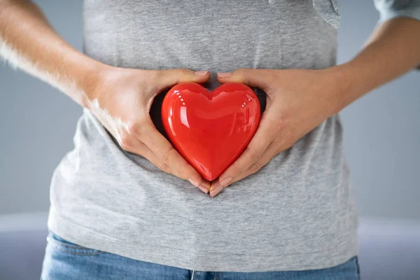 Pregnant Woman Making Heart Shape With Hands