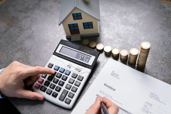 Businessman Coins House Model Using Calculator — Stock Photo, Image