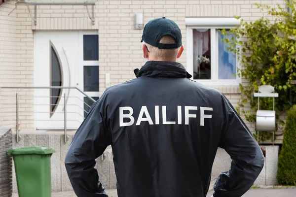 Rear View Male Bailiff Standing His Hands Hips House Entrance — Stock Photo, Image