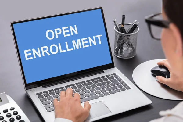 Close Person Working Laptop Open Enrollment Text Screen — Stock Photo, Image