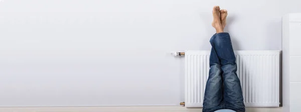 Man Warming His Feet Radiator Home — Stock Photo, Image