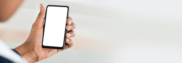 Close-up Of Businessperson Holding Mobile Phone With Blank Display