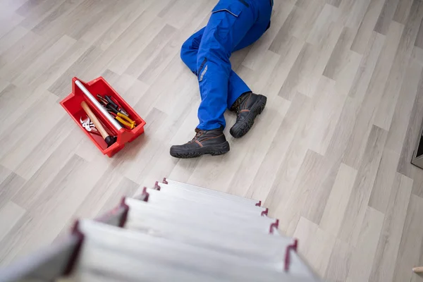 Unconscious Handyman Fallen Ladder Equipment Lying Floor — Stock Photo, Image