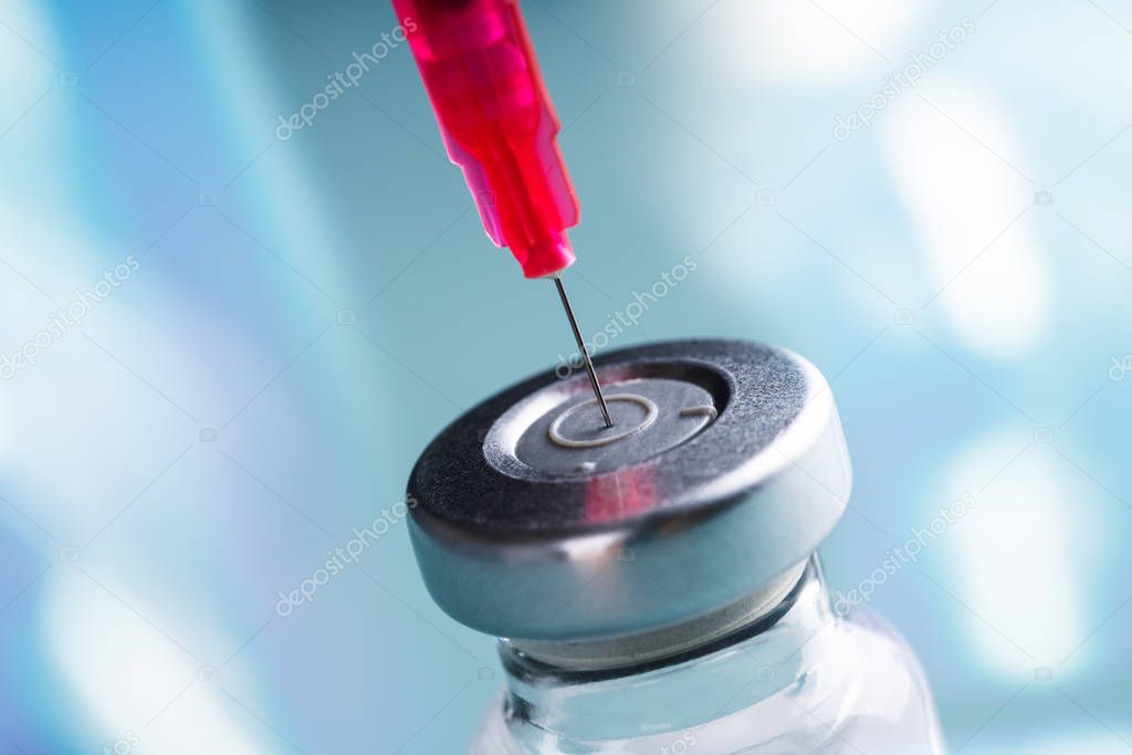 Close-up Of Filling Vaccine Syringe In Clinic