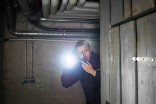 Rear View Security Guard Standing Basement Holding Flashlight — 스톡 사진