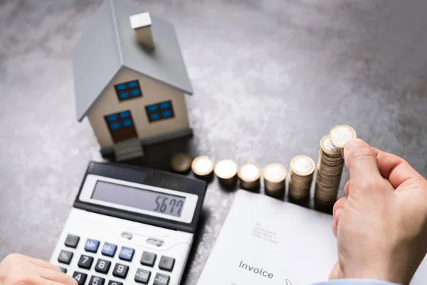 Businessman Coins House Model Using Calculator — Stock Photo, Image