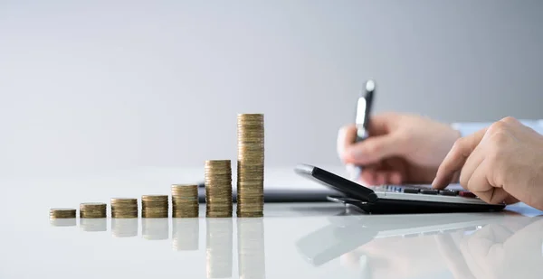 Businessman Calculating Invoice Stacked Coins Arranged Office Desk — Stock Photo, Image