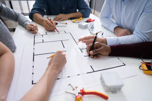 Elevated View Of An Architects Drawing Plan On Blueprint With Electrical Components